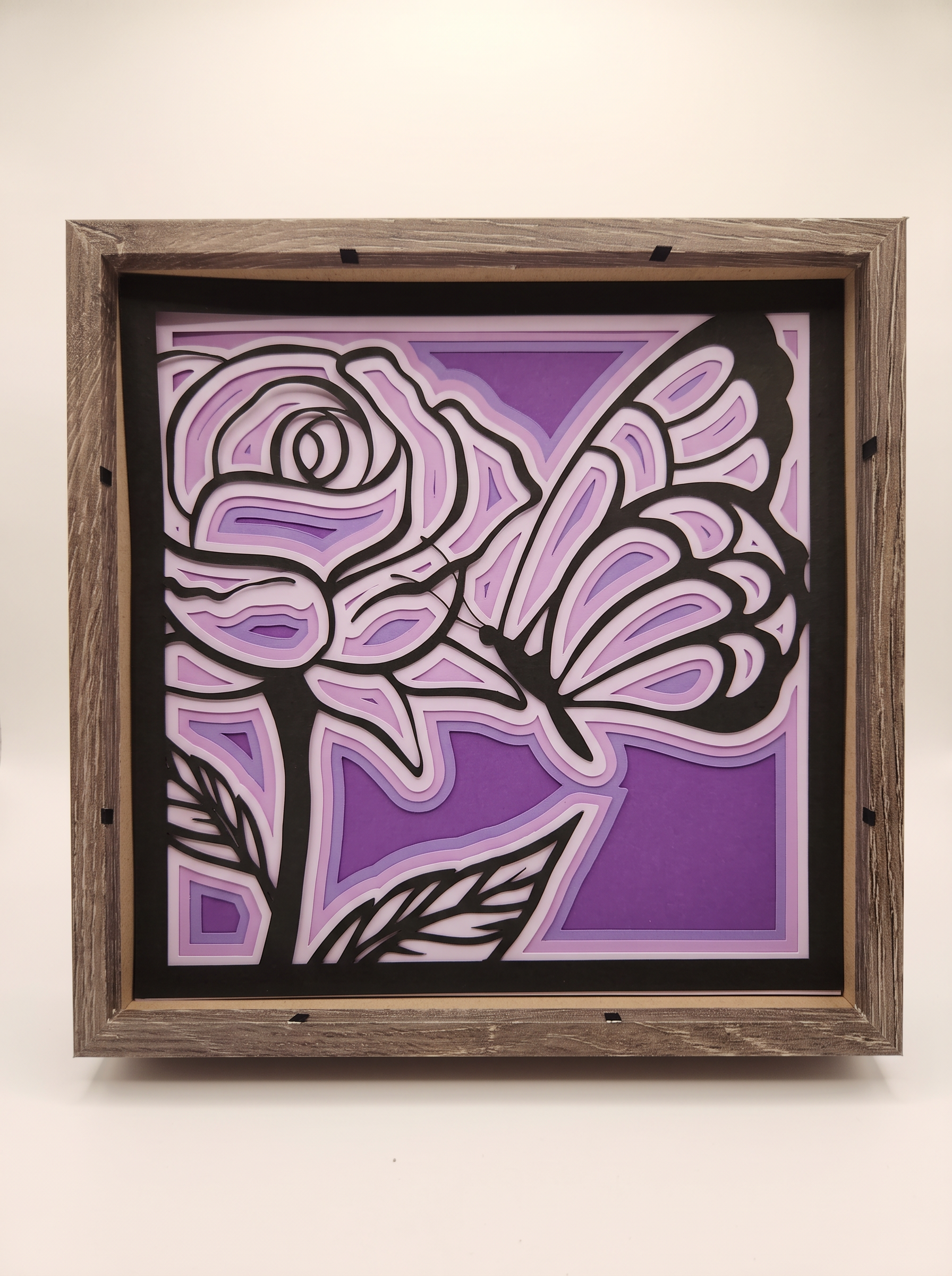Purple layered paper rose and butterfly art in a rustic wood frame