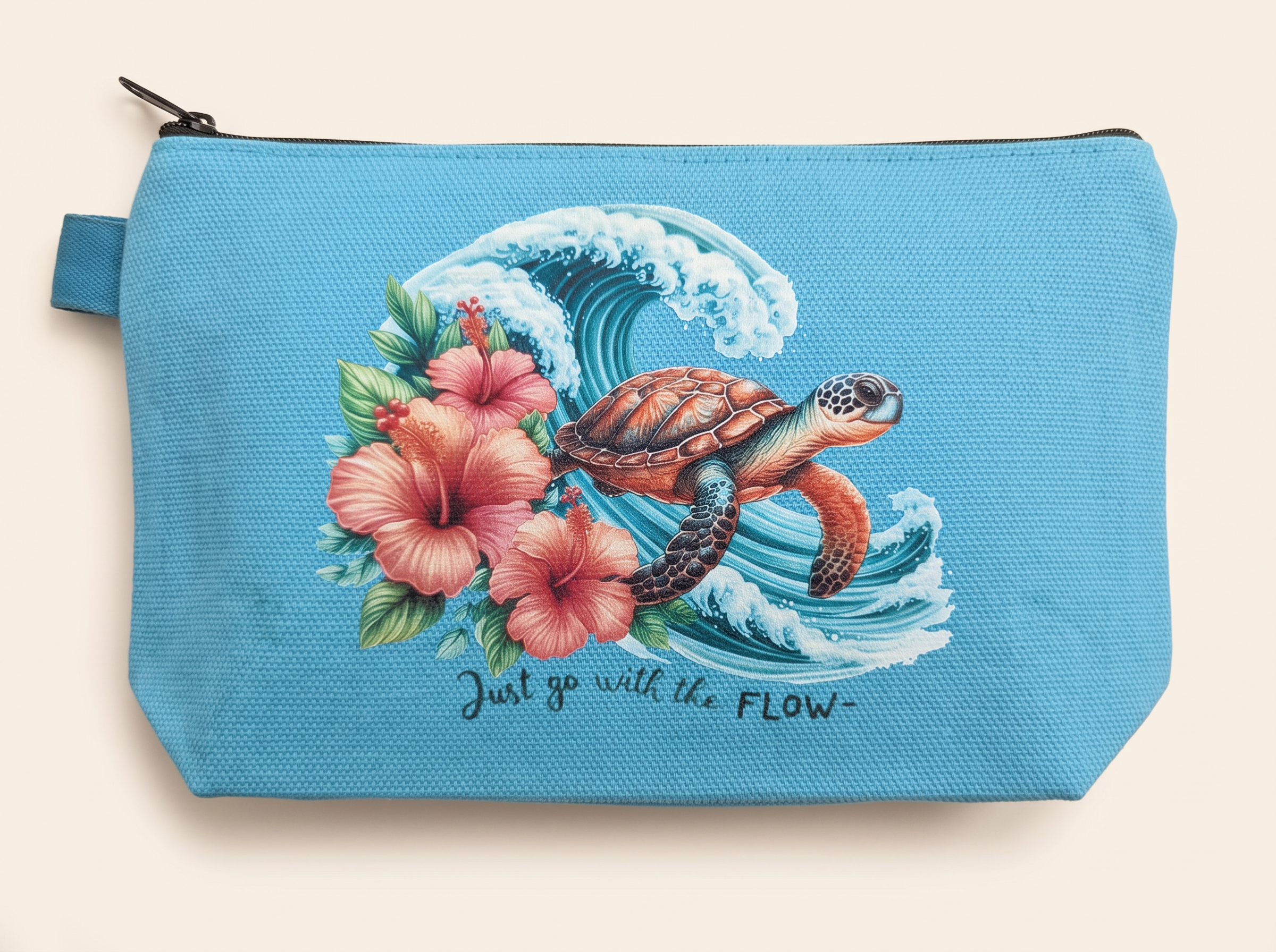 Teal canvas zip pouch printed with a sea turtle, wave and hibiscus design